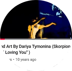 Professional sand animation artist Daria Tym performing live sand art