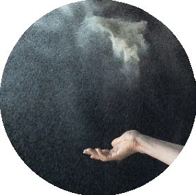 Hand of sand artist creating an emotional sand art moment, symbolizing art with soul in live performances by Daria Tym